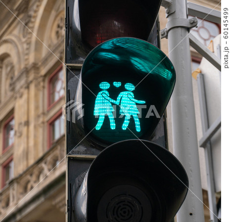 Lovely pedestrian traffic lights. Couple holding hands, green light. Vienna, Austria 60145499