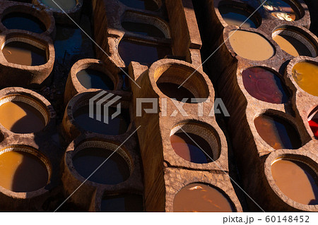 Chouara tannery in old medina in Fes, a traditional and old tannery with workers working making methods of leather in the city Fes, Morocco 60148452