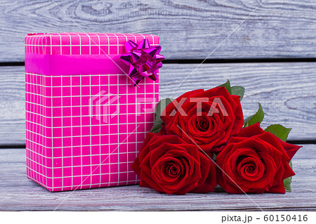 Valentines Day gift box and red roses. 60150416