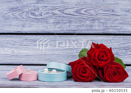 Boxes with jewelry and red roses. Boxes with jewelry and red roses. 60150535