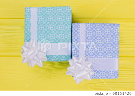 Gifts in boxes on wooden background. 60151420