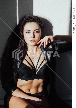Portrait of a beautiful fashionable woman in black underwear in the bedroom 60152122