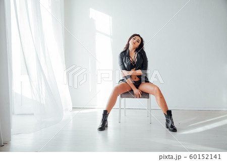 Portrait of a beautiful fashionable woman in black underwear in the bedroom Portrait of a beautiful fashionable woman in black underwear in the bedroom 60152141