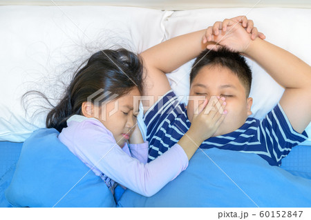 Annoying snoring. Sister covered her brother's 60152847