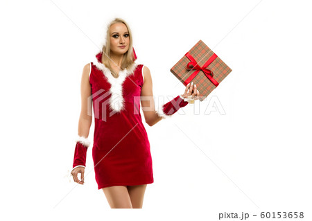 A beautiful sexy girl in a New Year's dress, hold 60153658