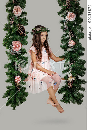 Happy child girl on swing 60153874