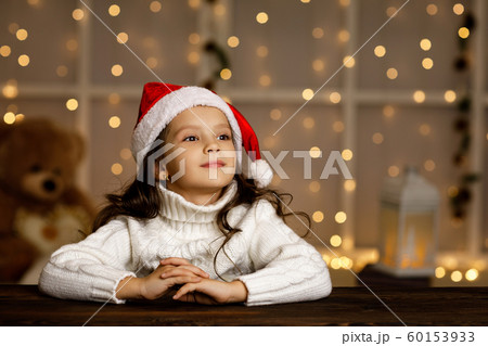Happy little child girl in santa hat 60153933