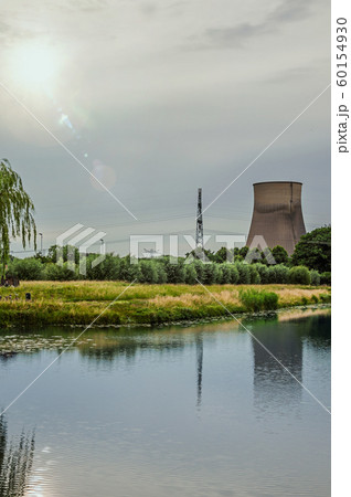 Canal with gardens and nuclear power plant in Geertruidenberg 60154930