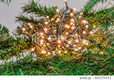 Bokeh Christmas tree indoors fairy lights ball illuminating. Bokeh Christmas tree indoors fairy lights ball illuminating. 60155453