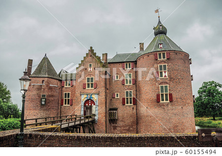 Medieval Ammersoyen Castle with its brick towers Medieval Ammersoyen Castle with its brick towers 60155494