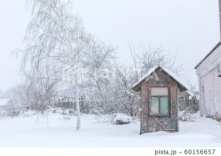 An old gatehouse in the middle of a snowy 60156657