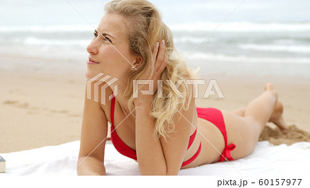 A relaxing day on a sandy beach at the ocean A relaxing day on a sandy beach at the ocean 60157977