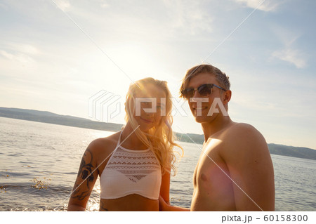 Portrait Of Beautiful Smiling Young Man And Woman At Beach 60158300