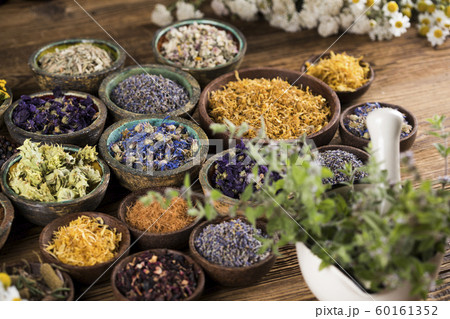 Natural remedy,Herbal medicine and wooden table Natural remedy,Herbal medicine and wooden table 60161352