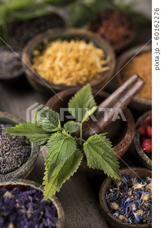 Natural remedy,Herbal medicine and wooden table Natural remedy,Herbal medicine and wooden table 60162276