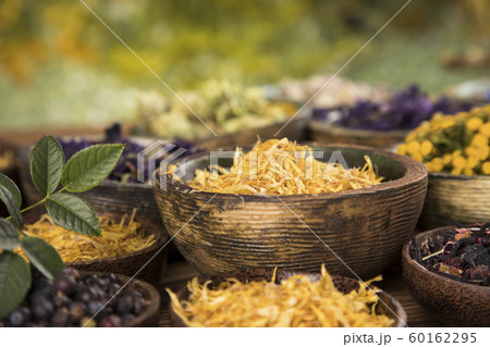 Natural remedy,Herbal medicine and wooden table Natural remedy,Herbal medicine and wooden table 60162295
