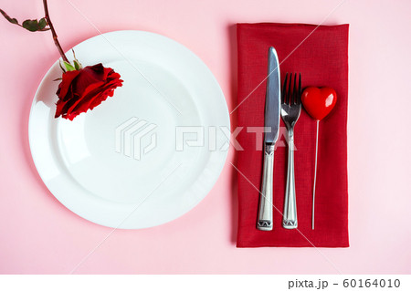 Romantic table setting for Valentines day or dinner date celebration wedding. 60164010