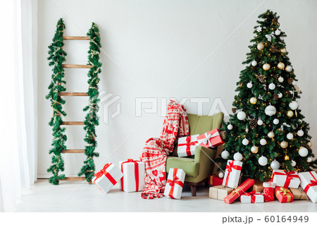 Christmas tree with gifts for the new year decor of the white room winter holiday Christmas tree with gifts for the new year decor of the white room winter holiday 60164949