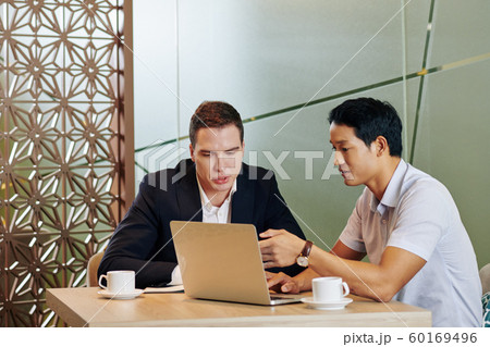 Business people meeting in cafe Business people meeting in cafe 60169496