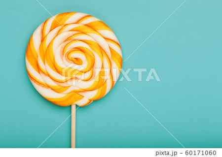 Colorful round Lollipop, on mint blue background. 60171060
