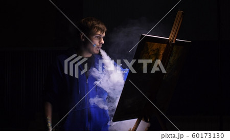 Artist copyist paint seascape with ship in ocean. Vaper smoke vape e-cigarette. Craftsman decorator draw as boat sail on blue sea with acrylic color. 60173130