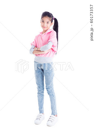 Full length of asian pretty girl standing and smiles over white 60173357