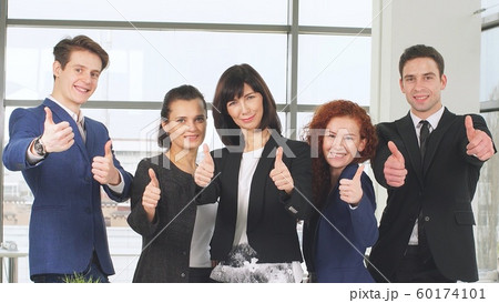 Office and teamwork concept, group of business people having a meeting and showing thumbs up. 60174101
