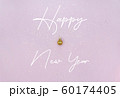 New Year celebration concept. Golden Christmas ball, lettering and golden star sequins on pastel 60174405