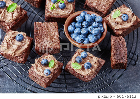 close-up of brownies with berries on a wire stand close-up of brownies with berries on a wire stand 60176112