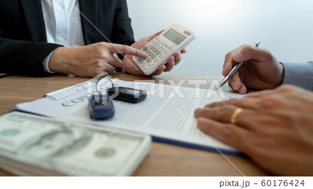agent broker man holding document showing an 60176424