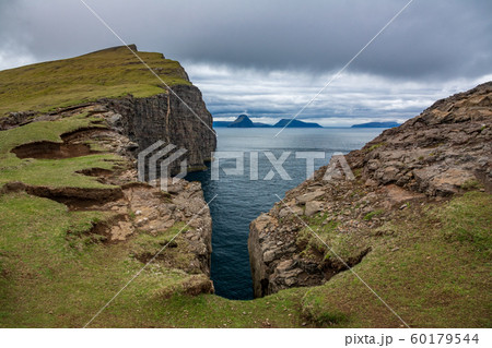 Sorvagsvatn cliffs over the ocean in Faroe Islands 60179544