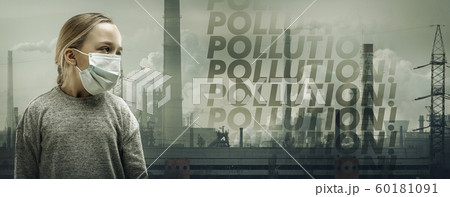 Caucasian girl wearing the respiratory protection mask against air pollution and dusk with factories on background 60181091