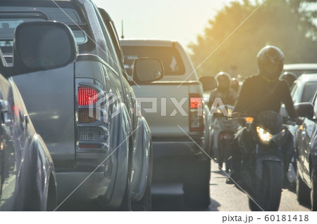 people driving car on road traffic jam with rush hour in the city 60181418