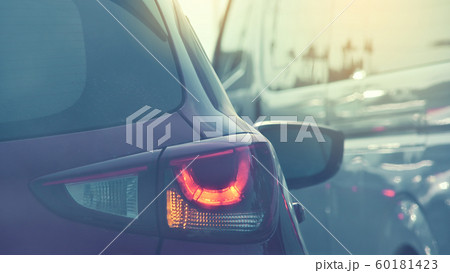 people driving car on road traffic jam with rush hour in the city 60181423