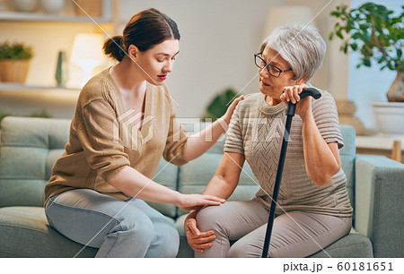 Elderly patient and caregiver 60181651
