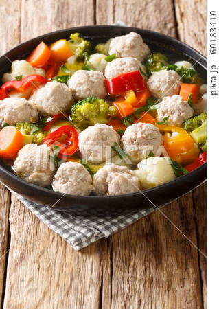 Healthy soup with chicken meatballs and vegetables 60183410