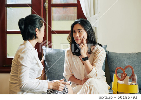 Woman listening to friend 60186793