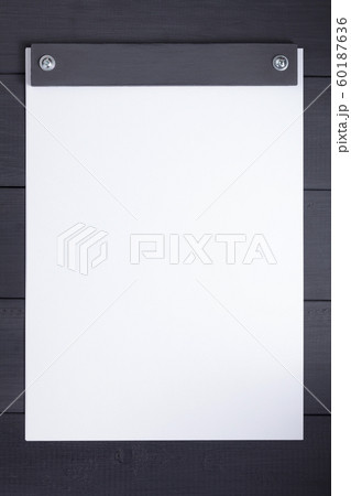 sheet of paper with empty pages on black 60187636
