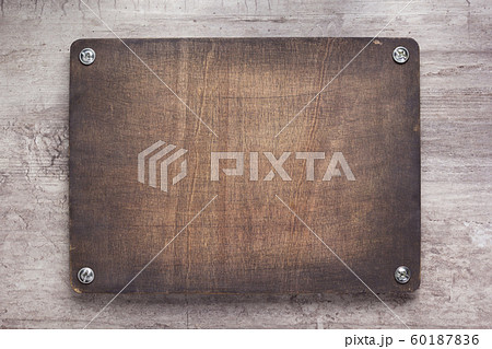 wooden nameplate or wall sign at concrete 60187836