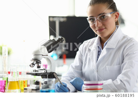 Smiling biomedical researcher in eyewear Smiling biomedical researcher in eyewear 60188195