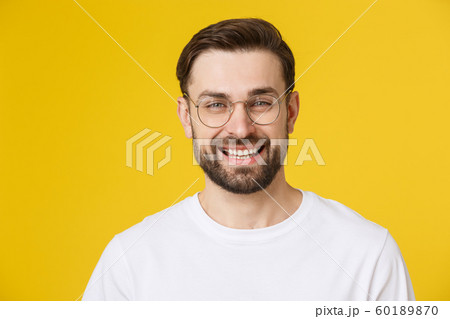 Young casual man portrait isolated on yellow background Young casual man portrait isolated on yellow background 60189870