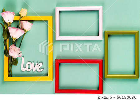 Color frames with flowers eustoma on bleached coral paper background with copy space. Love concept 60190636