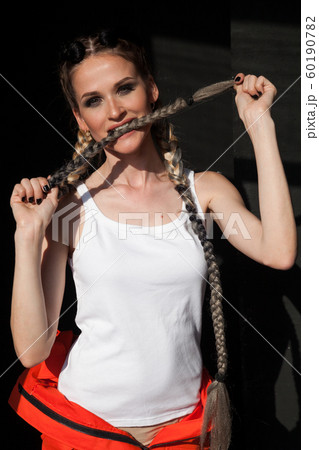 Beautiful fashionable woman with braids dancing break Beautiful fashionable woman with braids dancing break 60190782
