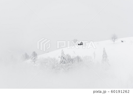 Fantastic landscape with snowy house 60191262
