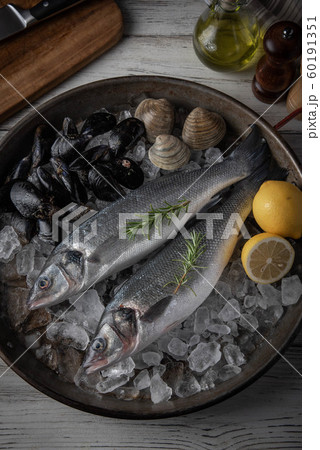 fresh branzini, european sea bass, with clam and fresh branzini, european sea bass, with clam and 60191351