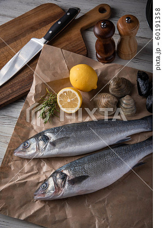 fresh branzini, european sea bass, with clam and fresh branzini, european sea bass, with clam and 60191358