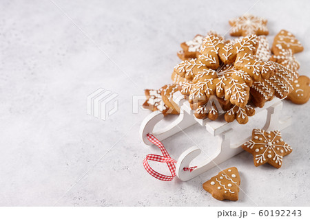 Gingerbread cookies on white wooden sledge Gingerbread cookies on white wooden sledge 60192243