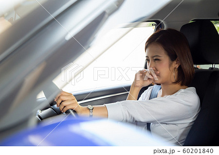 Young Asian woman hold her nose because of bad Young Asian woman hold her nose because of bad 60201840