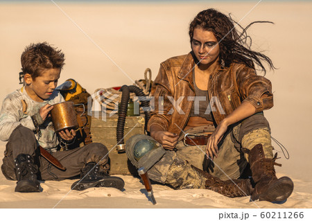 Post Apocalyptic Woman and Boy Outdoors in the Wasteland 60211266