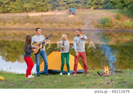 Group of happy friends with guitar, having fun 60211676